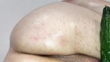 Close up cucumber insertion with massage oil and precum as lube